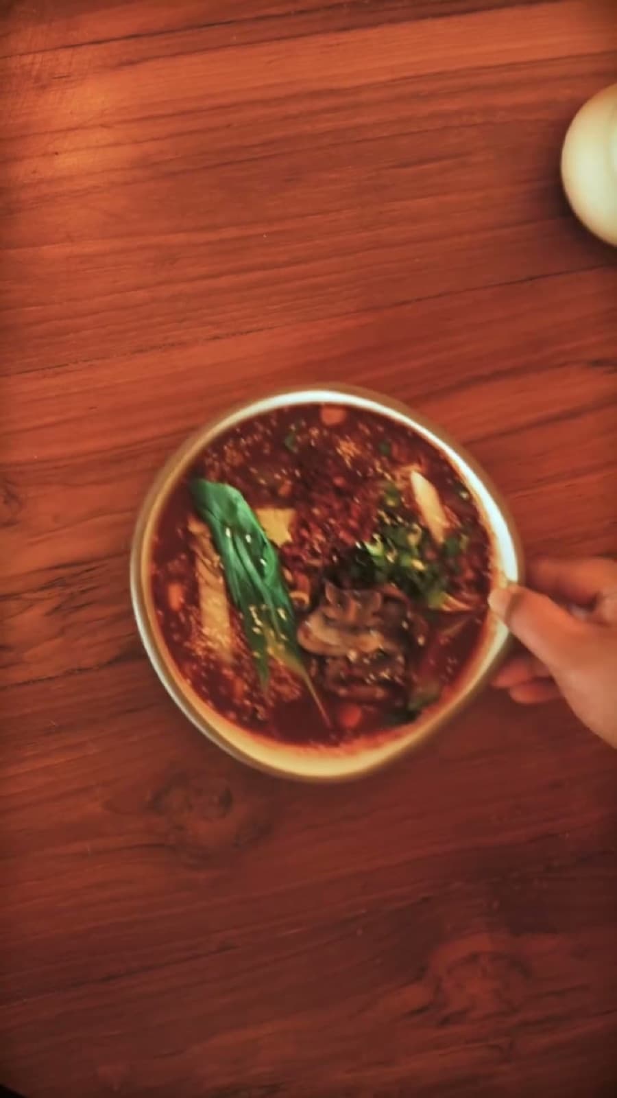 Overhead view of Korean ramen being twirled with a fork