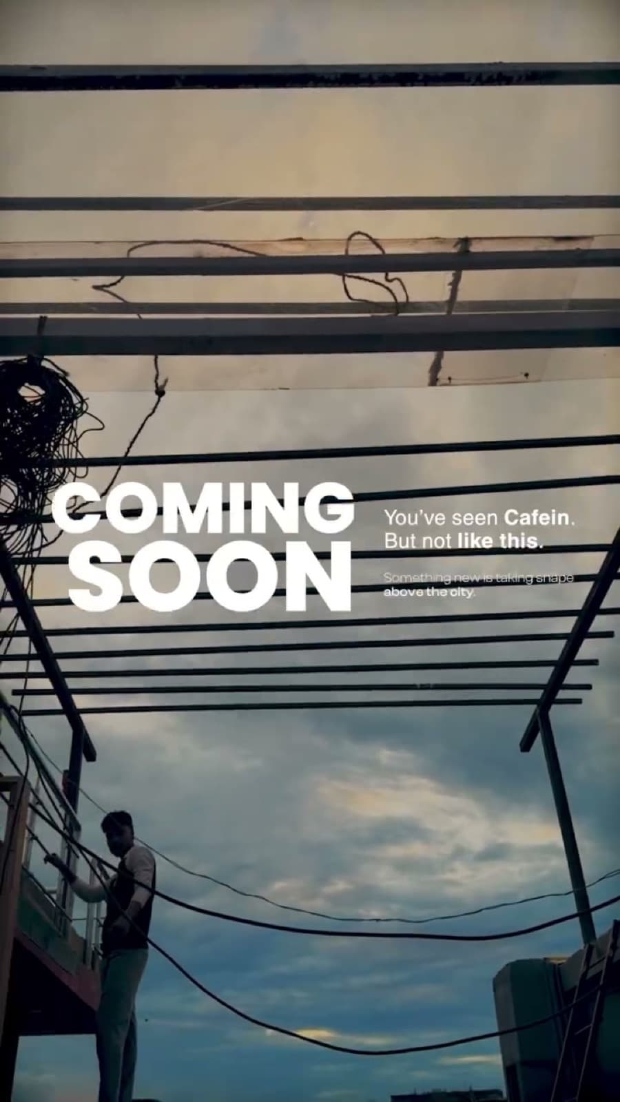 The Cafein rooftop under an evening sky, with the words coming soon